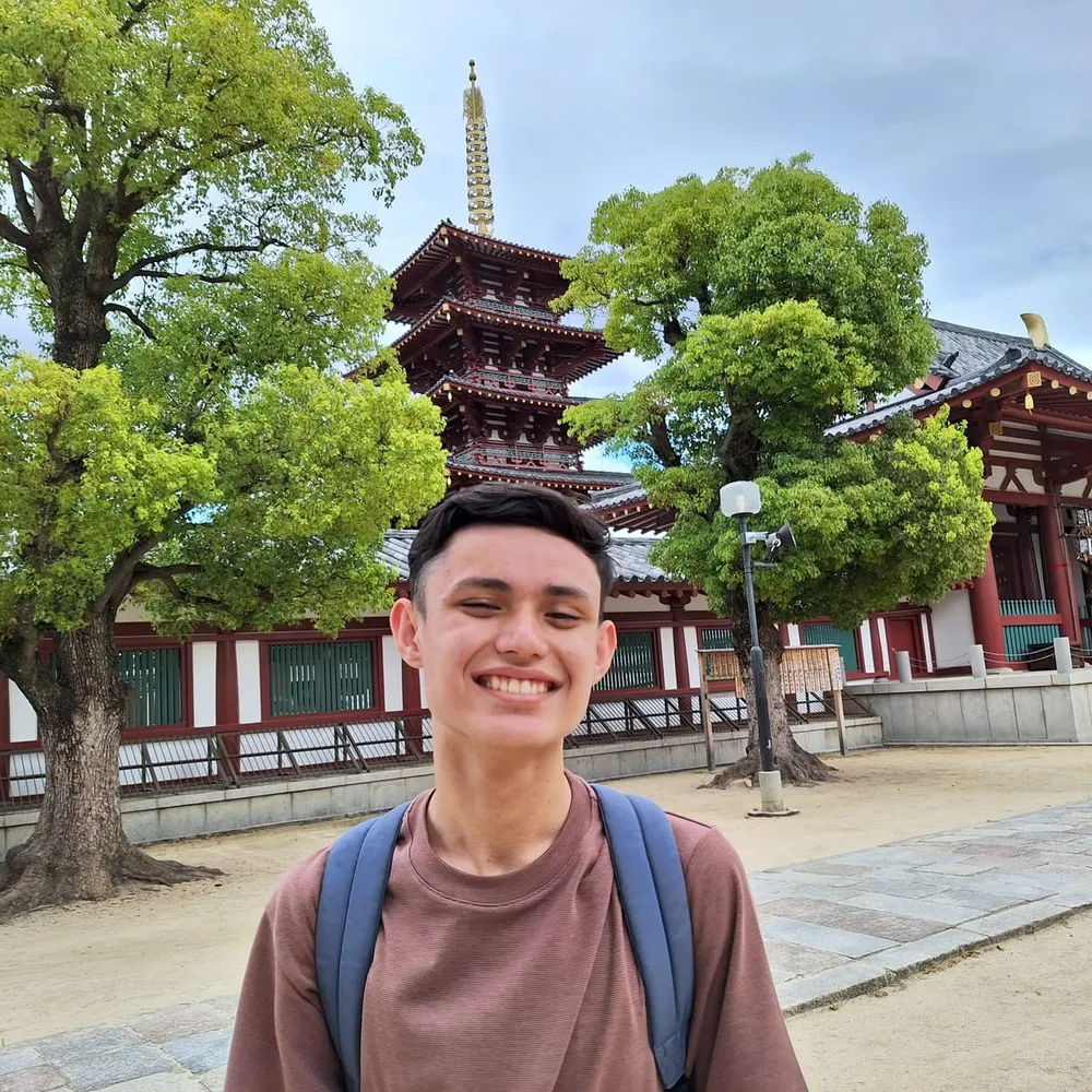 Ryan posing in front of a temple in Kyoto