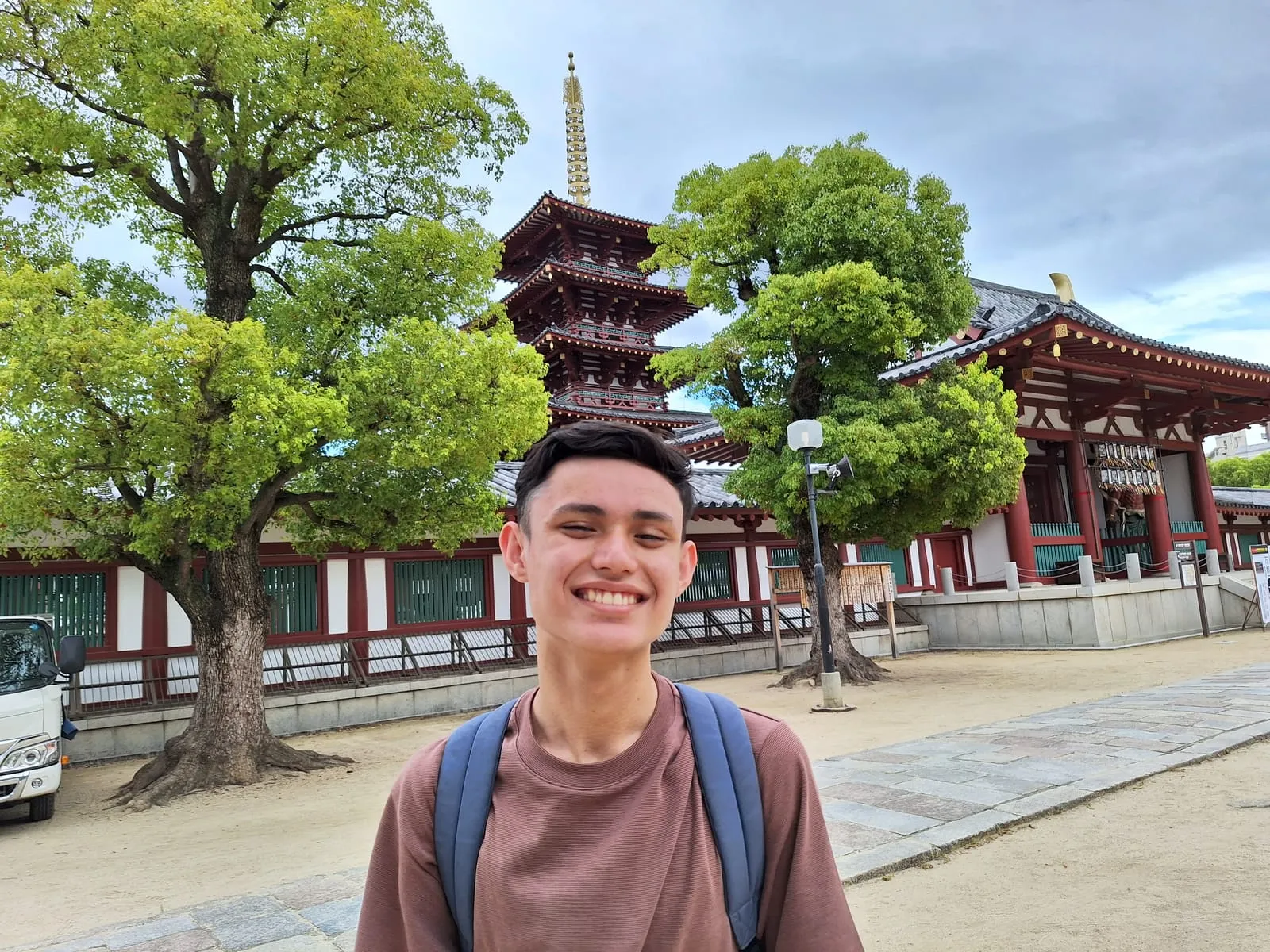 Ryan posing in front of a temple in Kyoto